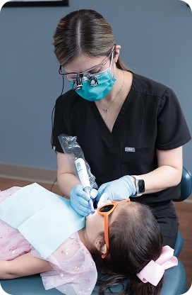 A child smiling during a pediatric dental appointment