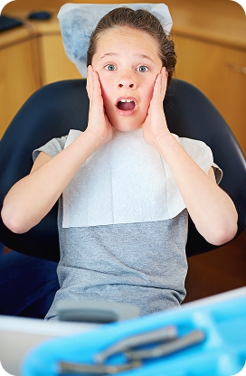 A child smiling during a pediatric dental appointment