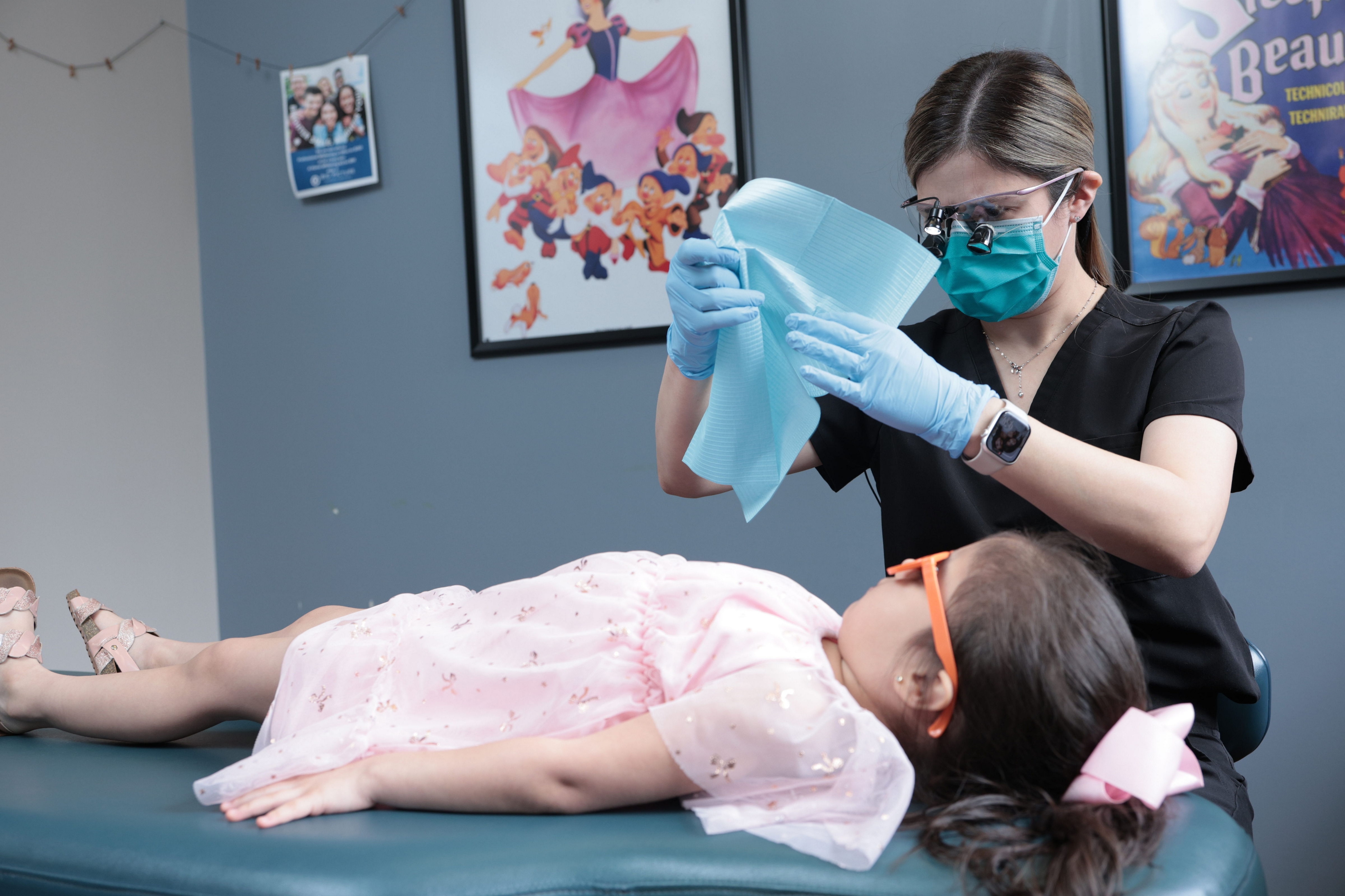 Dentist examining a young child