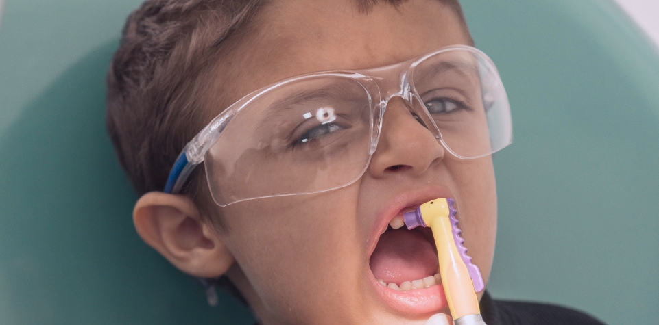 Child receiving dental treatment