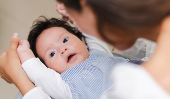 Parent feeding a newborn