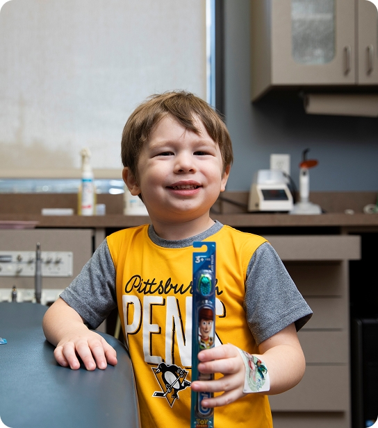 Infant being examined by a pediatric dentist