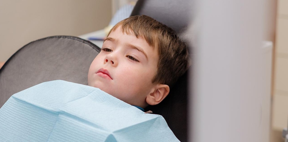 Child receiving dental treatment