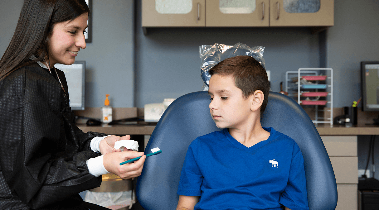 Dr. Brock examining a young patient